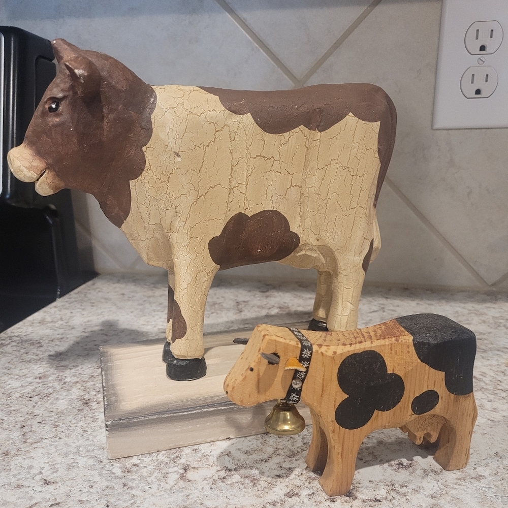 Two Wooden Cow Figurines